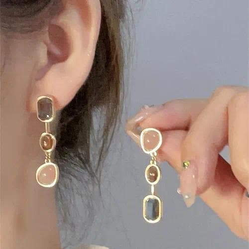 Aretes de embutido en cobre con forma de corazón y circonita