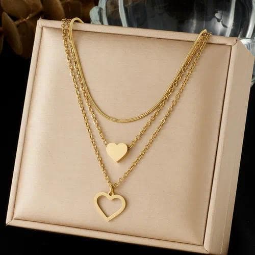 Collar en capas con colgante de forma de corazón dorado