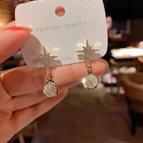 Aretes de moda en aleación con diseño de estrellas y perla artificial